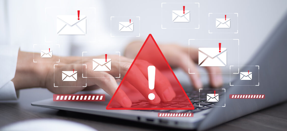 筆電畫面顯示多封帶有警示符號的電子郵件,象徵可疑中獎通知與釣魚詐騙風險。